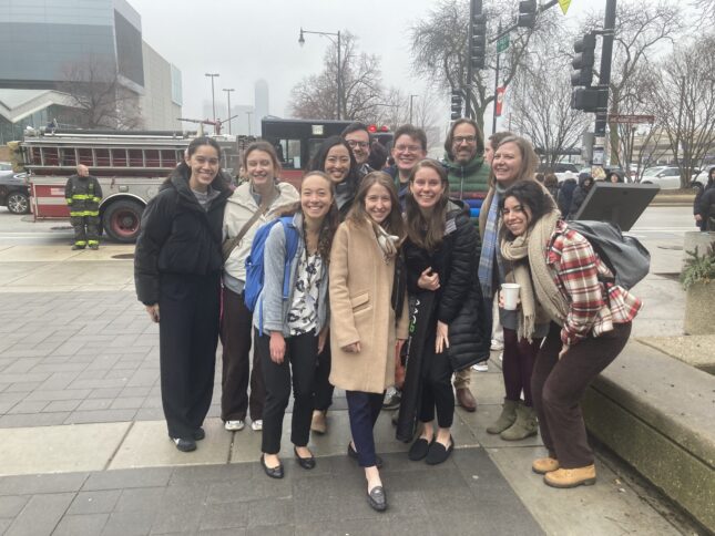 Group of students and leaders with the firetruck that had to respond to the 2024 KTGF conference.